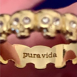 Pura Vida Gold metal Skull ring with clear crystals.